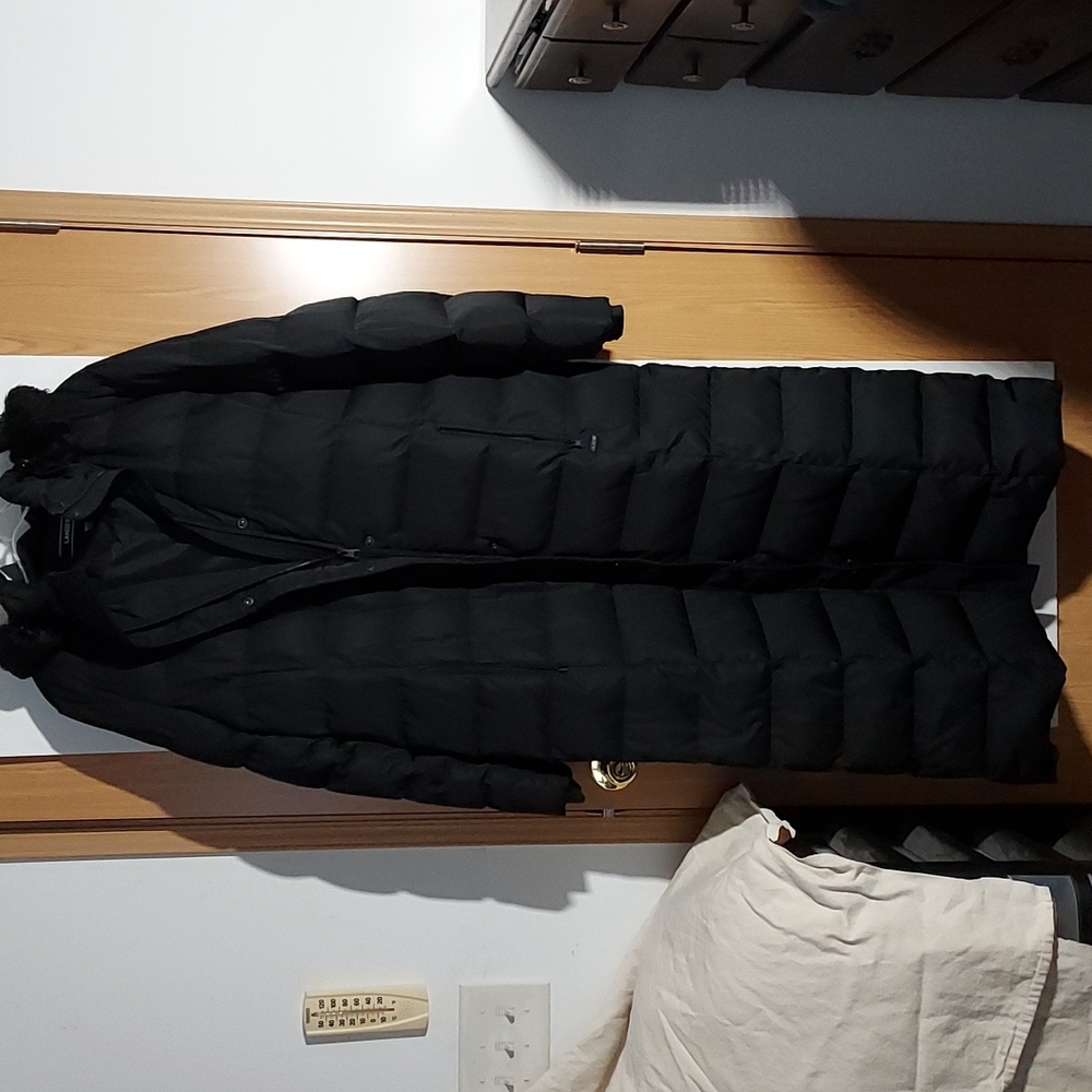 A beautiful black lands end long winter coat with fur around the Hood
